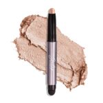 Single Champagne Shimmer crème-to-powder eyeshadow stick with a built-in smudger, showcasing its shimmery finish.