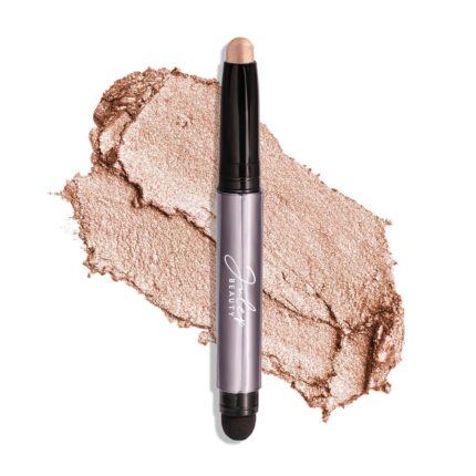 Single Champagne Shimmer crème-to-powder eyeshadow stick with a built-in smudger, showcasing its shimmery finish.