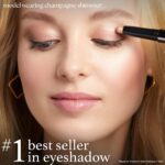 Single Champagne Shimmer crème-to-powder eyeshadow stick with a built-in smudger, showcasing its shimmery finish.
