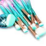 An 11-piece makeup brush set with rosegold and multicolor handles, suitable for all skin types.