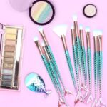 An 11-piece makeup brush set with rosegold and multicolor handles, suitable for all skin types.
