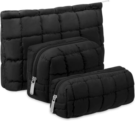 Set of three black puffy quilted checkered cosmetic bags with zippers, shown in various sizes for travel and organization