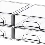 Four clear plastic stackable storage drawers on a desk, filled with various small items like pens, makeup, and hair clips.