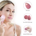 Four pink makeup sponges in various shapes, with a drying holder and a protective egg-shaped storage case