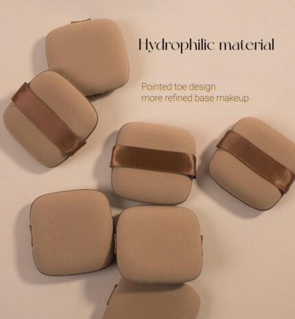 A set of five brown square foundation sponges, shown ready for use with liquid makeup.