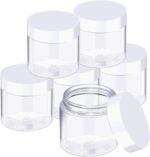 Set of six clear 3 oz plastic jars with white screw-on lids for storage and organization