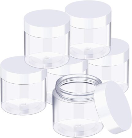 Set of six clear 3 oz plastic jars with white screw-on lids for storage and organization