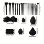 36-piece black makeup brush set with synthetic bristles and ergonomic handles for professional application.