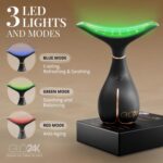 A black LED face and neck massager wand with a sleek design, shown with its protective cover and charging cable.