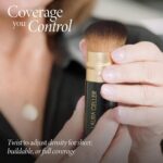Retractable black kabuki airbrush foundation brush with dense nylon bristles and an aluminum handle