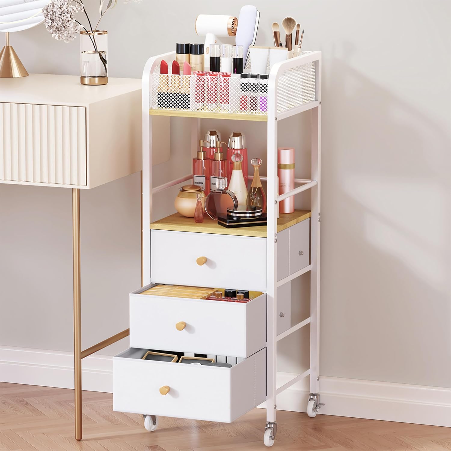White and natural wood rolling makeup cart with three fabric drawers and top compartments for beauty storage