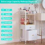 White and wood rolling makeup organizer cart with divided top, open shelf, and two fabric drawers, filled with cosmetics.