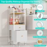 White and wood rolling makeup organizer cart with divided top, open shelf, and two fabric drawers, filled with cosmetics.