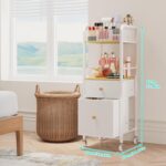 White and wood rolling makeup organizer cart with divided top, open shelf, and two fabric drawers, filled with cosmetics.