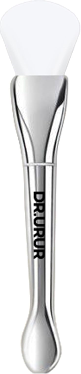 Soft silicone brush applicator for applying face masks, creams, and lotions evenly on the skin, showing the flexible head and