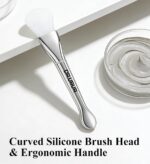 Soft silicone brush applicator for applying face masks, creams, and lotions evenly on the skin, showing the flexible head and