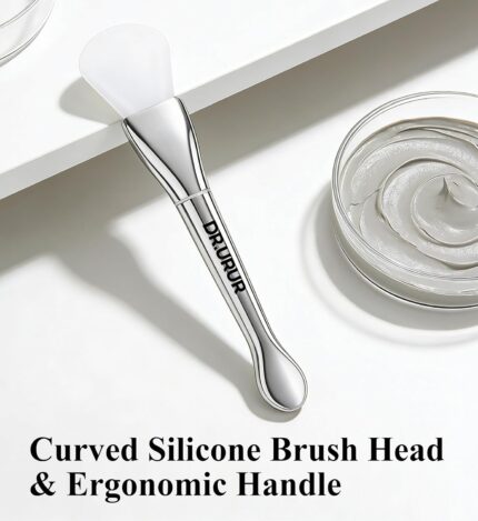 Soft silicone brush applicator for applying face masks, creams, and lotions evenly on the skin, showing the flexible head and